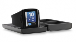 The Qualcomm Toq smartwatch in charging dock